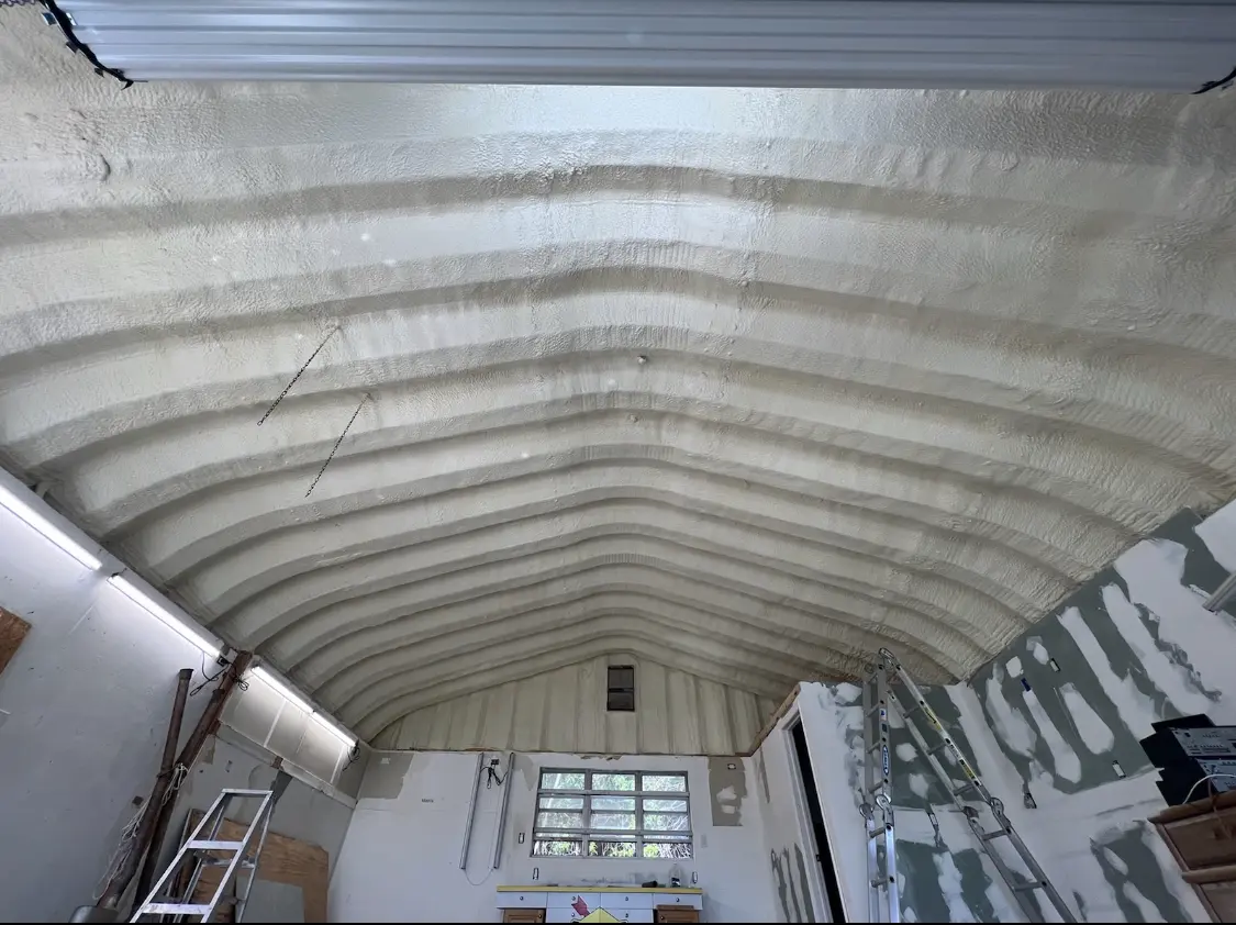 Spray polyurethane foam applied to the underside of a metal roof deck in Coldwater